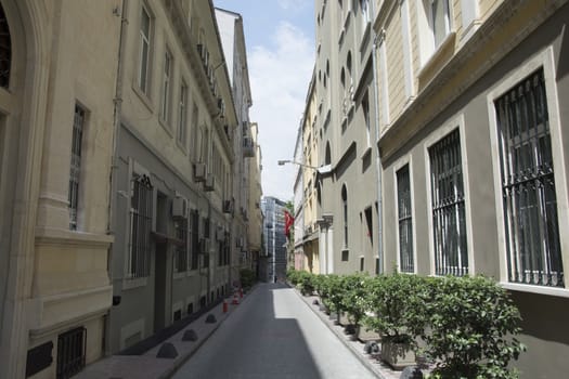 One side of the street is shadow, the other side is sunny. Banks Street/İstanbul