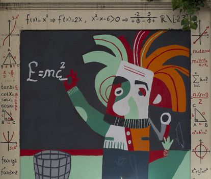 Einstein's famous E = mc² equation. The street wall is very nicely drawn.