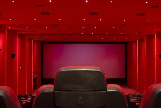 Empty, red movie theater. Movie starts