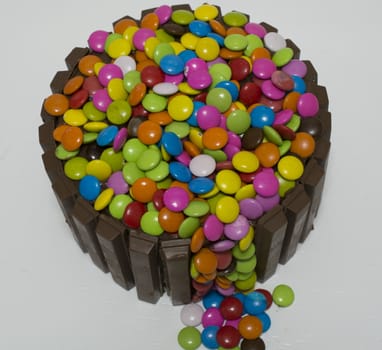 chocolate cake. decorated with chocolate waffles and candy