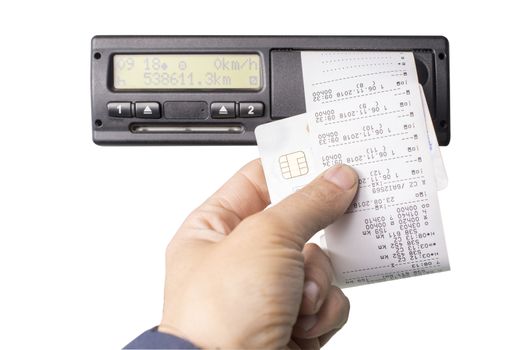 Digital tachograph and drivers hand holding print with driving times of the day. Isolated on white background. No personal data.