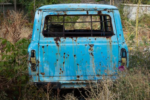 In nature, the car is abandoned, rotten over time, unusable