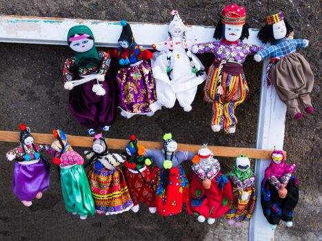various colored cloth dolls planted with hand crafts. turkish regional clothes