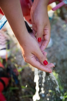 woman, wash your hands with clean water