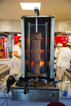 The kind of kebab that is cooked by passing meat pieces over a skewer and hanging upright
