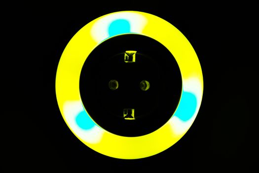 Lamp night light in a dark background. Vintage effect style picture. colorful night light. ring lamp. Neon light circle. the light takes the shape of a circle