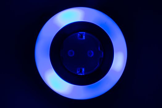 Lamp night light in a dark background. Vintage effect style picture. colorful night light. ring lamp. Neon light circle. the light takes the shape of a circle
