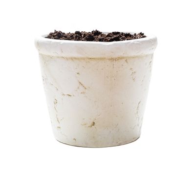 White ceramic flower pot with soil, isolated on white background