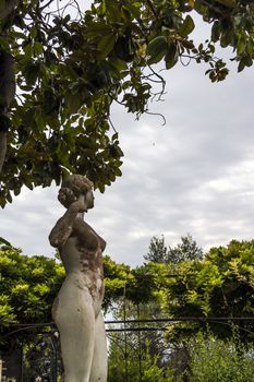 Achilleion palace, Corfu, Greece - August 24, 2018: Statue in the courtyard of Achilleion palace of Empress of Austria Elisabeth of Bavaria.