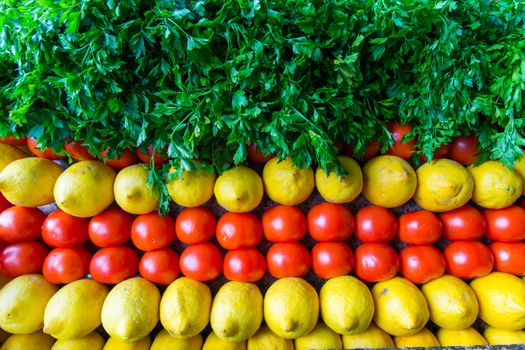 background arranged with tomatoes, lemon and parsley. vegetable and fruit framework. harvest. winter and spring. healthy nutrition background of different vegetables on table.