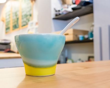 Colorful coffee mug on table