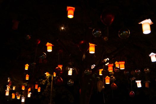 Adorned street trees. There are decorative balls, balloons, lamps and oil lamp. for Christmas, holidays and celebrations