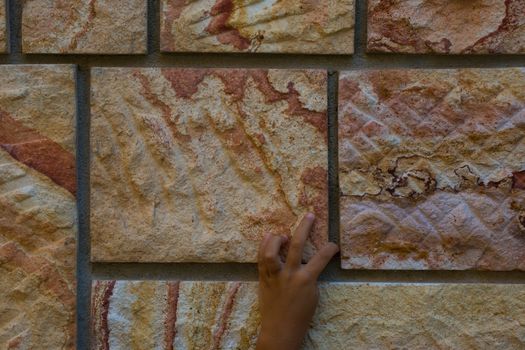 red wavy natural decorative stones. wall construction