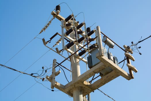 small transformer on the electric pole. city, mains electricity