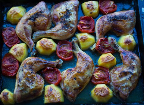 baked, fried, chicken baguette. cooked tomatoes and potatoes