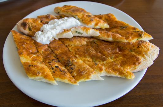 "Aydın" is made in the city "Bozdoğan". made from a mixture of cheese, egg and parsley. served with "kaymak"(cream) on top