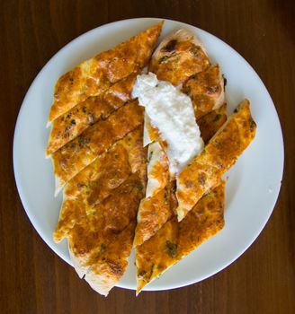 "Aydın" is made in the city "Bozdoğan". made from a mixture of cheese, egg and parsley. served with "kaymak"(cream) on top