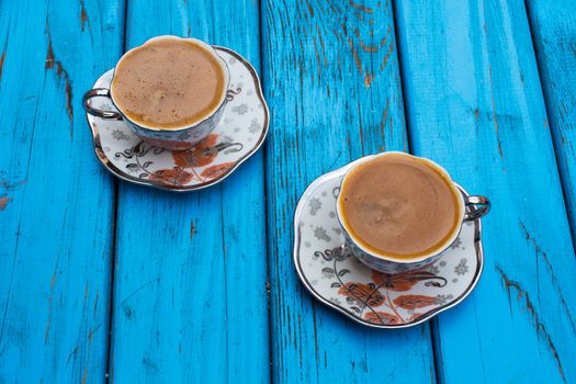 plenty of sparkling turkish coffee enjoyment. isolated blue background. Top view. Free space for your text