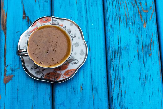 plenty of sparkling turkish coffee enjoyment. isolated blue background. Top view. Free space for your text