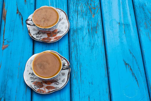 plenty of sparkling turkish coffee enjoyment. isolated blue background. Top view. Free space for your text