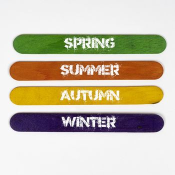 the four seasons write on coloured wooden slats