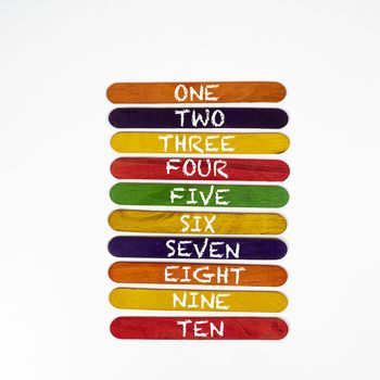 the numeration from one to ten on coloured wooden slats