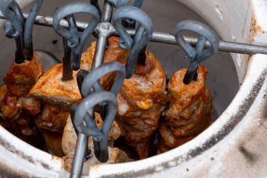 Skewers in the tandoor. Cooking kebab of meat in a tandoor