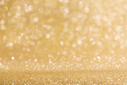 Abstract shining glitters golden holiday bokeh background with copy space for text