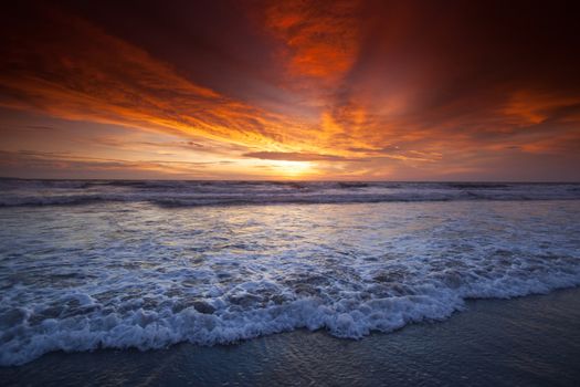 Beautiful majestic colorful sunset cloudscape over tropical sea at Bali