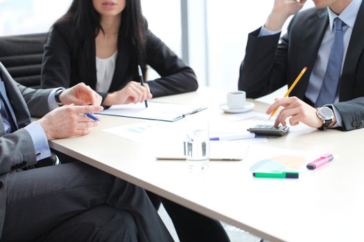 Business people discussing financial reports during a meeting