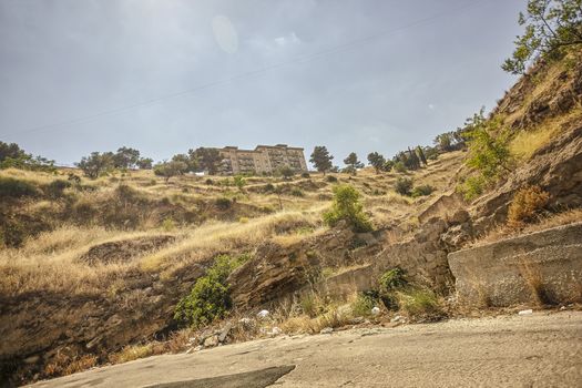 Homes between the Sicilian hills seen from the street