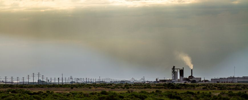 Smoke stack emitting pollution up into the environment