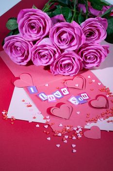 Roses and letters on a studio background