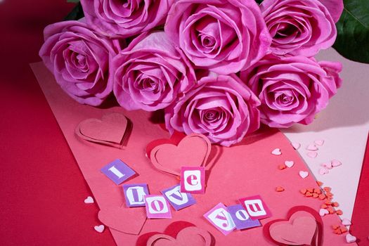 Roses and letters on a studio background
