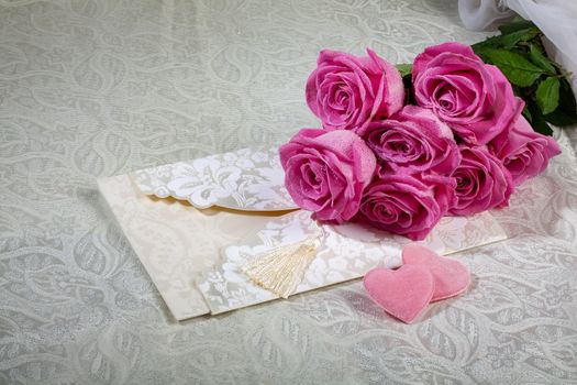 Bouquet and two hearts on a textured background