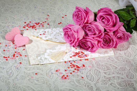 Bouquet and two hearts on a textured background