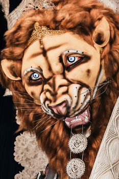 Kolkata India October 2018 - Close up portrait of Screaming horror face of King Bengal Tiger Head. Ghost cruel, Scary halloween shot in Durga Puja festival. A Lion symbolizes power to destroy evil.
