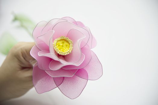 Woman making beautiful nylon flower - people with DIY handmade flower concept