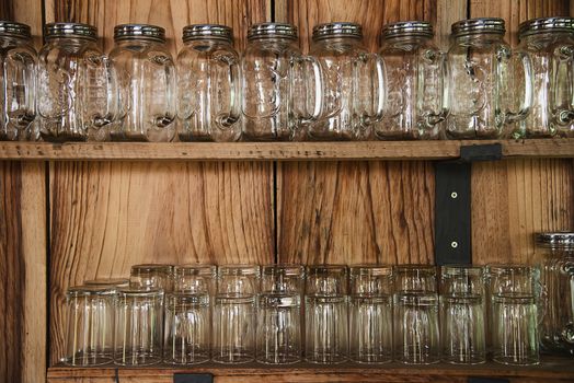 Glass ware in coffee shop with brown wooden wall - vintage style coffee shop decoration concept