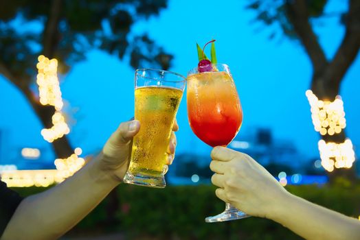 Couple celebration in restaurant with soft drink beer and mai tai or mai thai - happy lifestyle people with soft drink concept