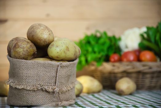 Fresh potato in kitchen ready to be cooked - fresh vegetable preparing for making food concept