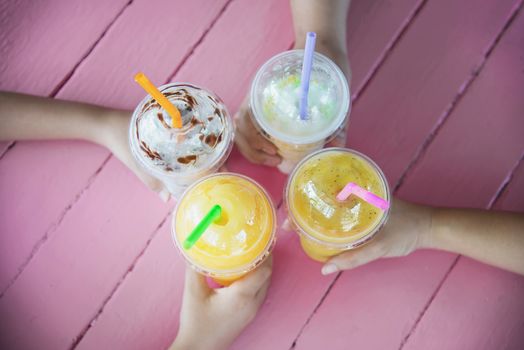 People enjoy celebration with cold blended juicy fruit drink cup - people happy lifestyle with colorful drink concept