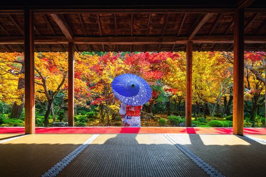 Asian woman wearing japanese traditional kimono in autumn at Enkoji temple, Kyoto, Japan.