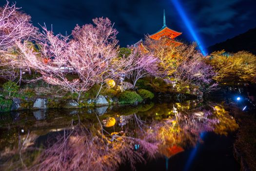 Red pagoda and Illumination at night in temple, Kyoto in Japan.
