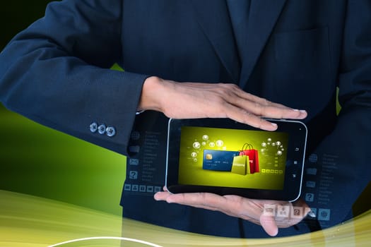Business man showing Online shopping concept in color background