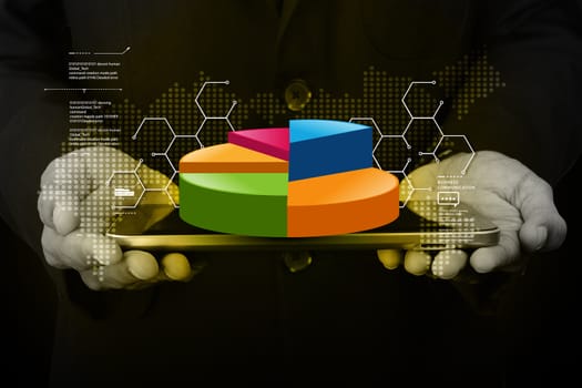 Business man showing pie chart with tablet computer in color background