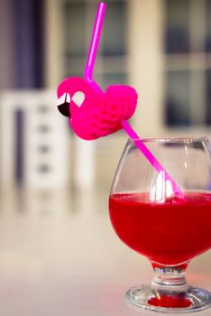 drink red with decorative drinking tube decorated with Flamingo figure