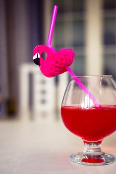 drink red with decorative drinking tube decorated with Flamingo figure