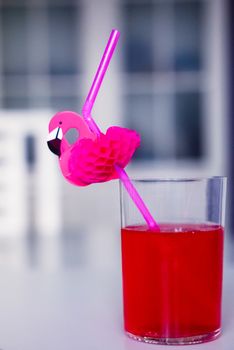 drink red with decorative drinking tube decorated with Flamingo figure