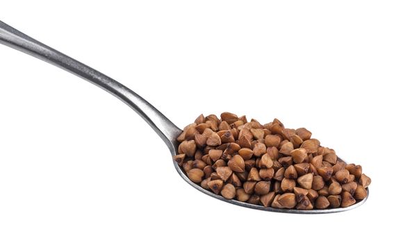Buckwheat grains in spoon isolated on white background with clipping path